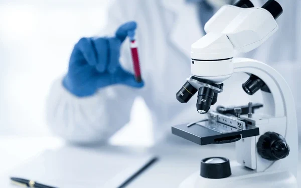 doctor-hand-taking-blood-sample-600nw-2179884263